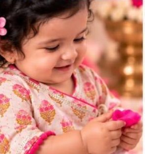 Baby in a soft floral angrakha