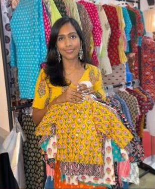 Evara showing a yellow block-print set at the bazaar